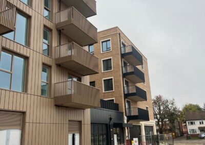 Image of building where brickwork and scaffolding is taking place.